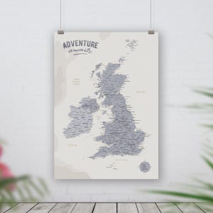 May include: A grey and white map of the United Kingdom with the text "Adventure awaits" at the top. The map shows the names of cities and towns throughout the UK.