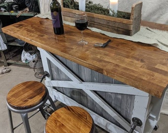 Farmhouse kitchen island with a built in wine rack, and casters, with great farmhouse features, this is a one of a kind Design!