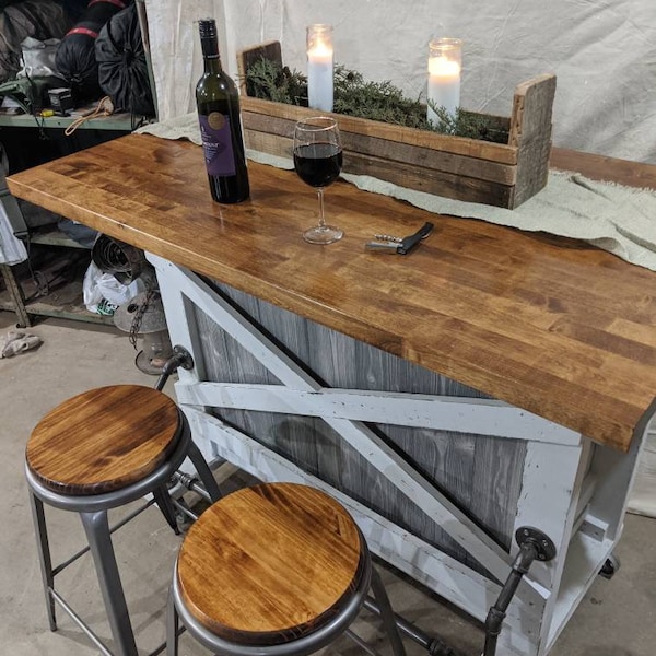 Farmhouse kitchen island with a built in wine rack, and casters, with great farmhouse features, this is a one of a kind Design!