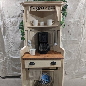 Stylish Corner coffee station crafted from a vintage door, with handy "k" cup racks, this corner coffee shelf fits nicely in any corner.