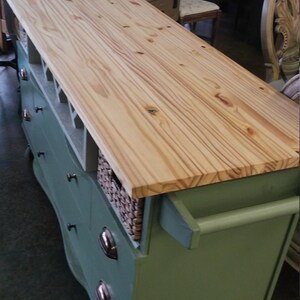 This recycled dresser makes the perfect kitchen island-With a handy wine rack crafted right in front and matching baskets-and slick design image 6