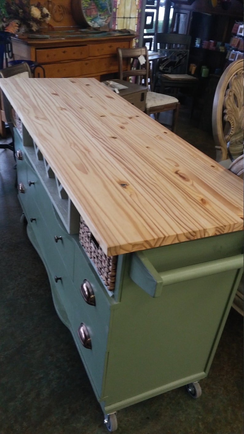 This recycled dresser makes the perfect kitchen island-With a handy wine rack crafted right in front and matching baskets-and slick design image 6