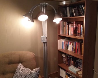 One of a kind!! Floor lamp, made from Galvanized electrical conduit, Galvanized flexible funnels and steel boxes. For a very unique look!!!