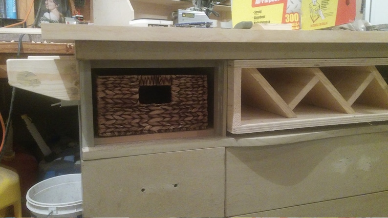 This recycled dresser makes the perfect kitchen island-With a handy wine rack crafted right in front and matching baskets-and slick design image 10