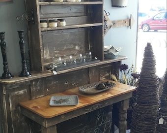 Vintage door turned into a dinning rm, or kitchen Buffet, kitchen storage from a upcycled door, or repurposed door for kitchen organization.