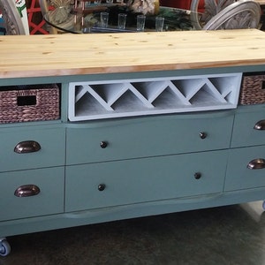 This recycled dresser makes the perfect kitchen island-With a handy wine rack crafted right in front and matching baskets-and slick design image 8