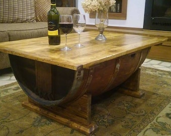 This wood coffee table made from a wine barrel is a nice industrial coffee table, (wood table) and a good place for your wine barrel decor!