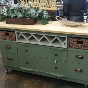 This recycled dresser makes the perfect kitchen island-With a handy wine rack crafted right in front and matching baskets-and slick design image 1