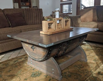 Wine barrel coffee table, hand crafted, with a real nice twist! Solid legs, and a nice wood top, and a bottle opener on the side just 4 fun!