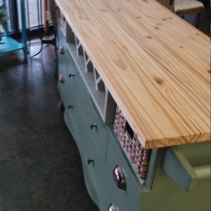 This recycled dresser makes the perfect kitchen island-With a handy wine rack crafted right in front and matching baskets-and slick design image 4