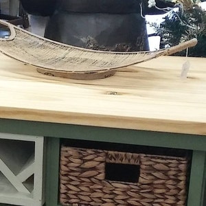 This recycled dresser makes the perfect kitchen island-With a handy wine rack crafted right in front and matching baskets-and slick design image 7