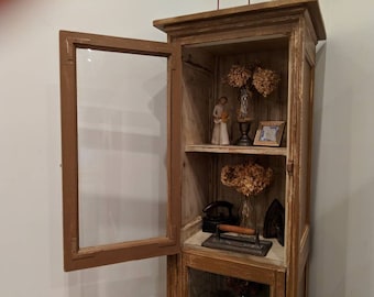 Hutch cabinet/curio cabinet made from a vintage recycled garage door, distressed paint giving it a surprising crisp look. With 3 shelves.