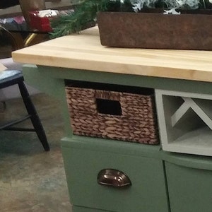 This recycled dresser makes the perfect kitchen island-With a handy wine rack crafted right in front and matching baskets-and slick design image 2