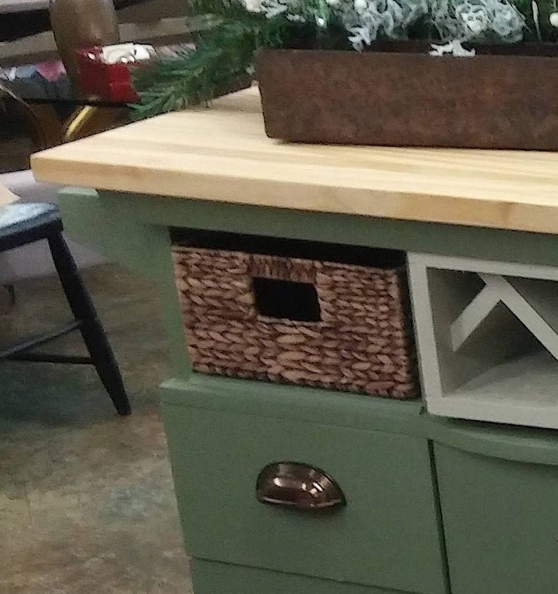 This recycled dresser makes the perfect kitchen island-With a handy wine rack crafted right in front and matching baskets-and slick design image 2