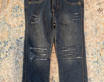 Jeans da bambino effetto consumato, con elastico in vita regolabile.