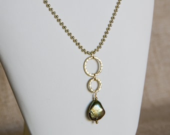 Iridescent green freshwater pearl pendant on gold colored beaded chain necklace