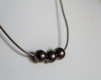 Brown Swarovski pearls on bronze leather necklace