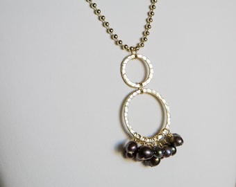 Iridescent brown freshwater pearl pendant on gold colored beaded chain necklace