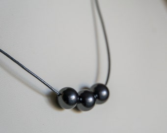 Gray Swarovski pearls on pewter leather necklace