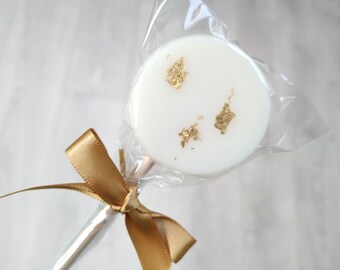 Ivory and gold leaf lollipops with satin bows