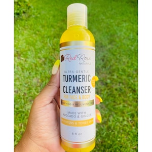 May include: A yellow bottle of Red Rose Naturals Turmeric Cleanser for face and body. The label reads "Ultra-Gentle" and "Made with Avocado & Ginger". The bottle contains 8 fl oz of product. The cleanser is designed to brighten and tone skin.