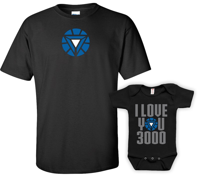 May include: A black t-shirt with a blue Iron Man arc reactor design and a black baby onesie with the text "I love you 3000" and a blue Iron Man arc reactor design.