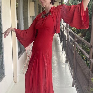 1930s bright red cold rayon crepe gown with matching bolero jacket, lantern sleeves and puffed shoulders, halter neck dress w crystal buckle
