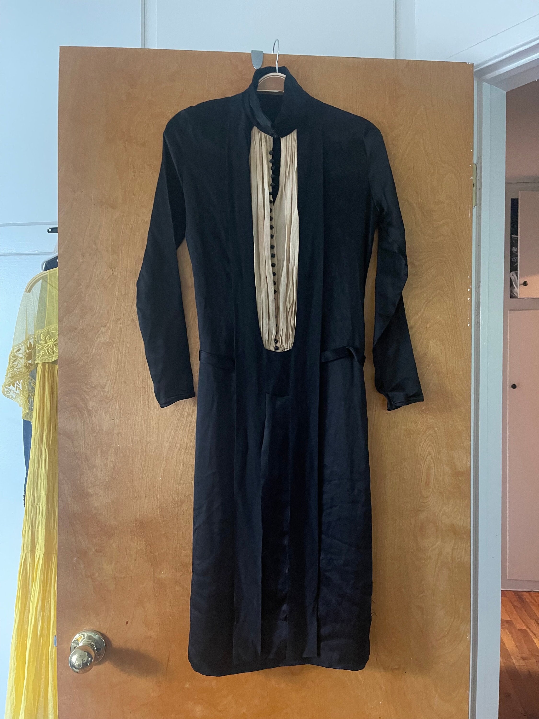 1920s black silk flapper dress with cream neckline and black buttons that look like dice!
