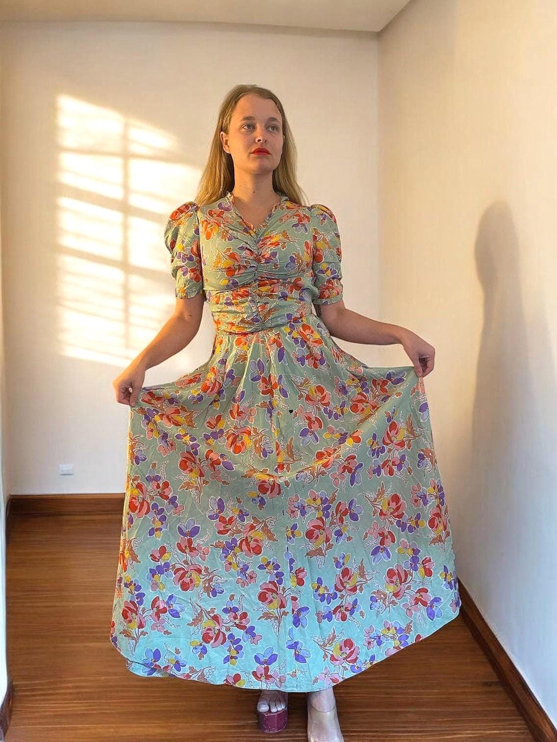 1930s floral dress in mint taffeta with puffed sleeves, ruched bodice, and full skirt; rare vintage