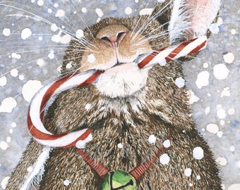 May include: A brown rabbit with a candy cane in its mouth and a green bell around its neck. The rabbit is standing in a snowy scene.