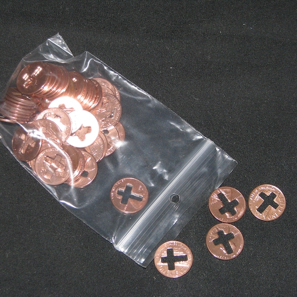 cross cut out pennies, pennies with a cross cut out, 50 pennies