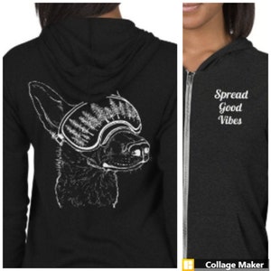 May include: Black zip-up hoodie with a white graphic of a dog wearing ski goggles on the back. The front of the hoodie has the text "Spread Good Vibes" in white.