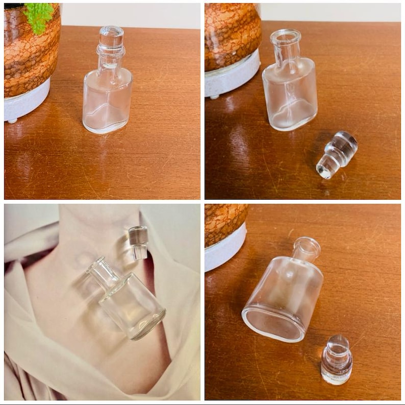 May include: Four clear glass bottles with stoppers. The bottles are of various sizes and shapes. The bottles are on a wooden surface.