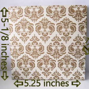 May include: A white card with a gold damask pattern. The card measures 5-1/8 inches by 5.25 inches.