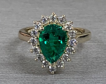 Pear Shape Green Emerald Engagement Ring With Round Moissanite Accents Made With Solid 14K Yellow Gold Item #6818