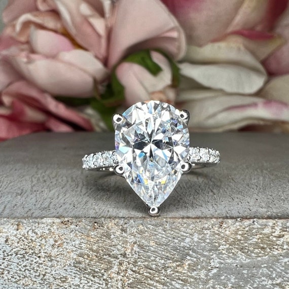 Moissanite Pear Shape Engagement Ring With Round Accents