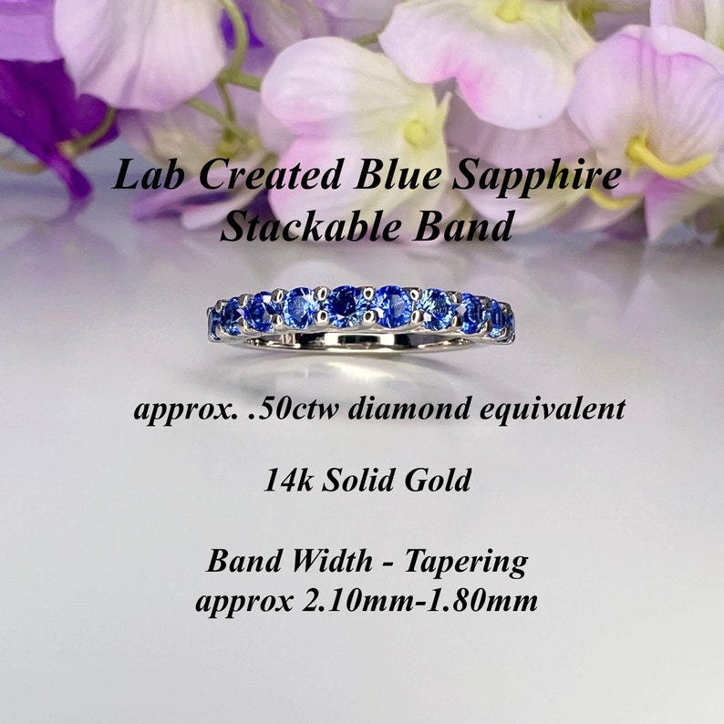 May include: A stackable band ring with blue sapphires set in 14k solid gold. The band is tapered, measuring approximately 2.10mm to 1.80mm wide. The sapphires are approximately 0.50 carats total weight, equivalent to a diamond.