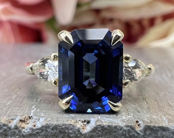 Emerald Cut Blue Sapphire Engagement Ring With Pear Shape Accents