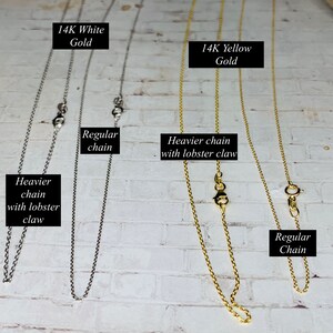 May include: Four gold chains, two in 14K white gold and two in 14K yellow gold. Two chains are regular and two are heavier with lobster claw clasps.