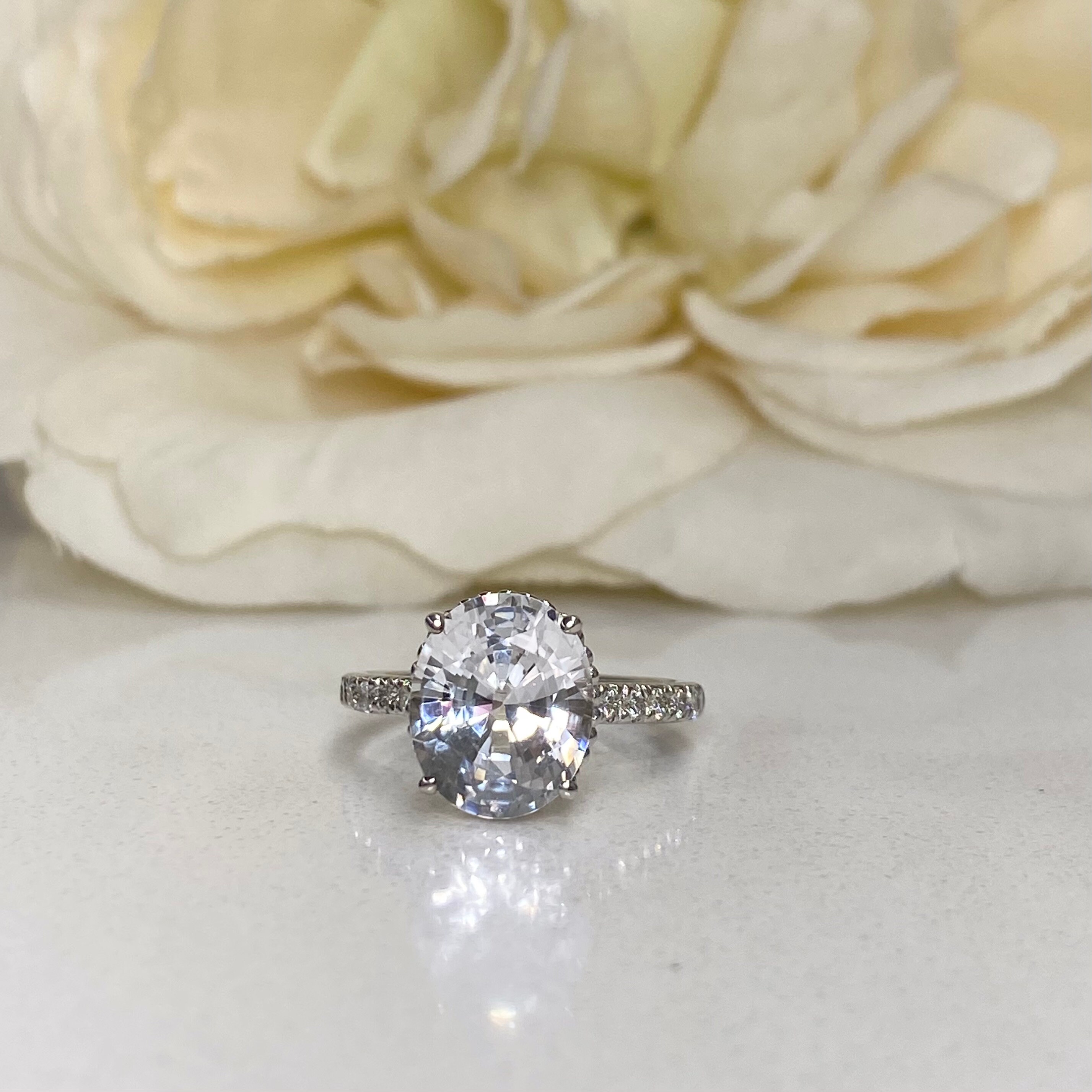 Oval white sapphire engagement rings discount