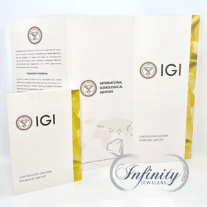 May include: A white and yellow IGI Laboratory Grown Diamond Report with the text "International Gemological Institute" and "Laboratory Grown Diamond Report". The report is from Infinity Jewelers.