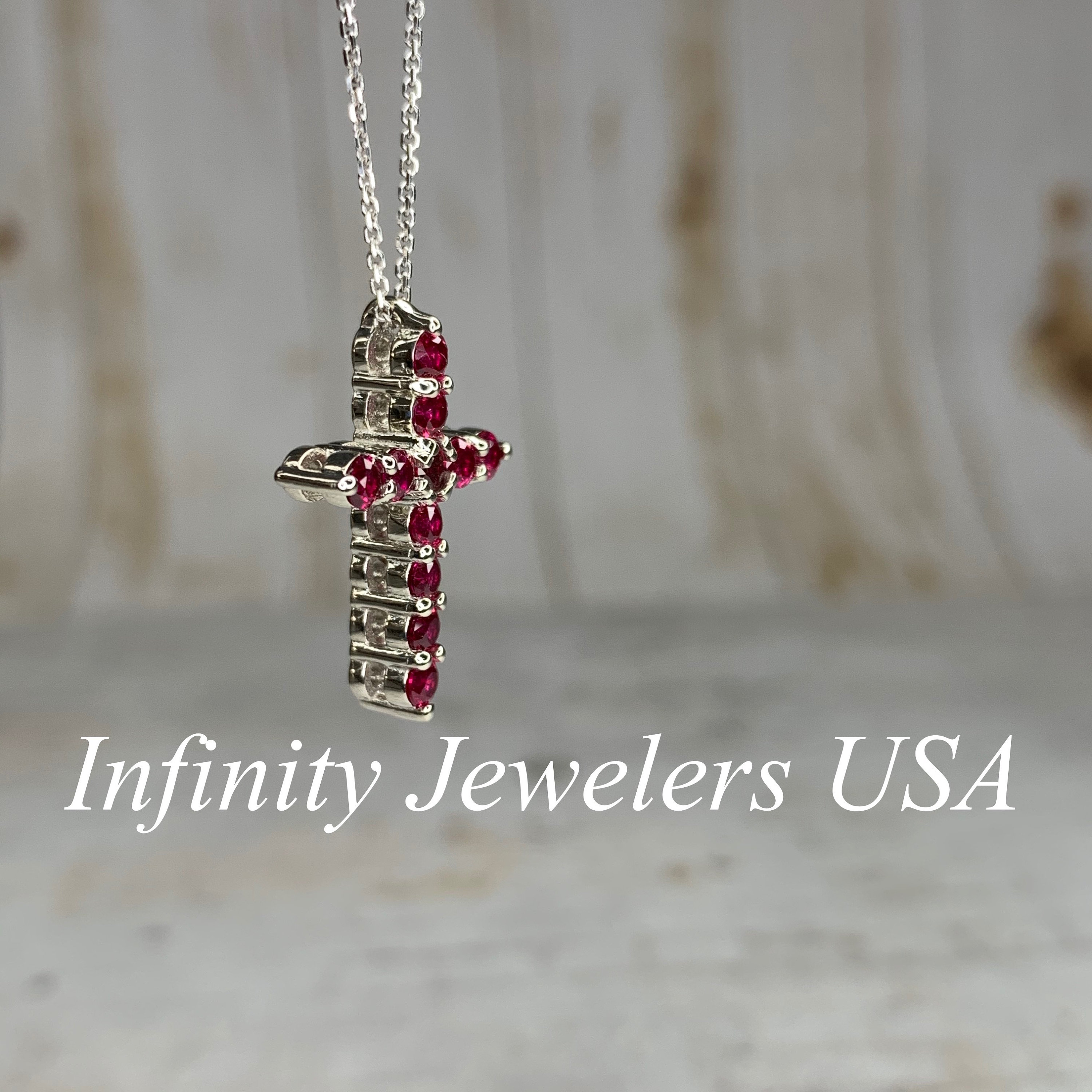 Cross with ruby best sale stone