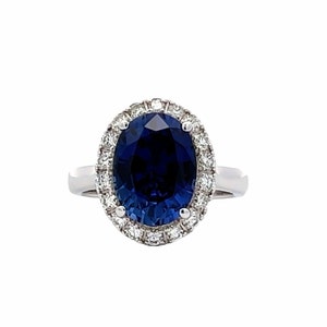 Elongated oval cut sapphire and diamond ring, with halo setting, 14k white gold #5627