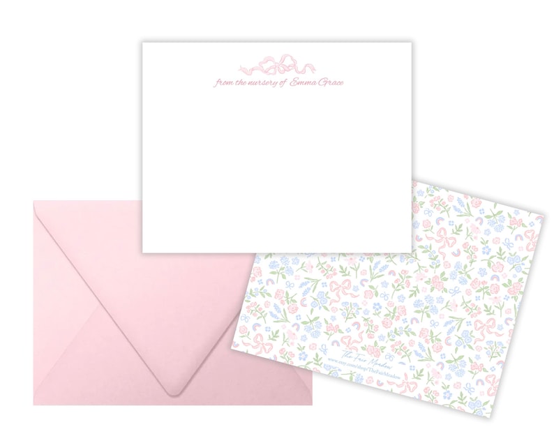 May include: A pink envelope with a white card featuring a floral design and the text "from the nursery of Emma Grace".