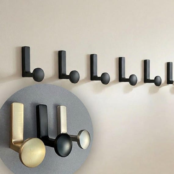Einzelne Garderobenhaken im modernen Stil. Gold Silber Schwarze Metallhaken. Wandhaken für Eingang und mehr