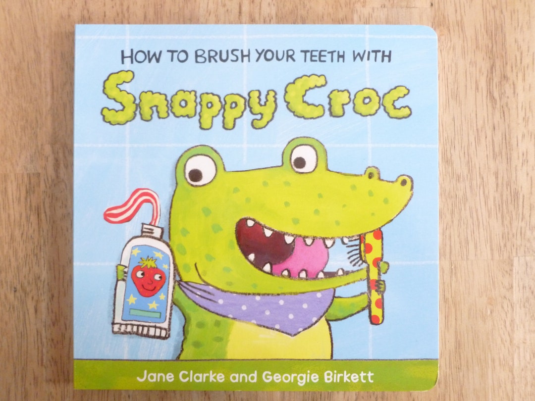 how-to-brush-your-teeth-with-snappy-croc-board-book-by-usborne-books