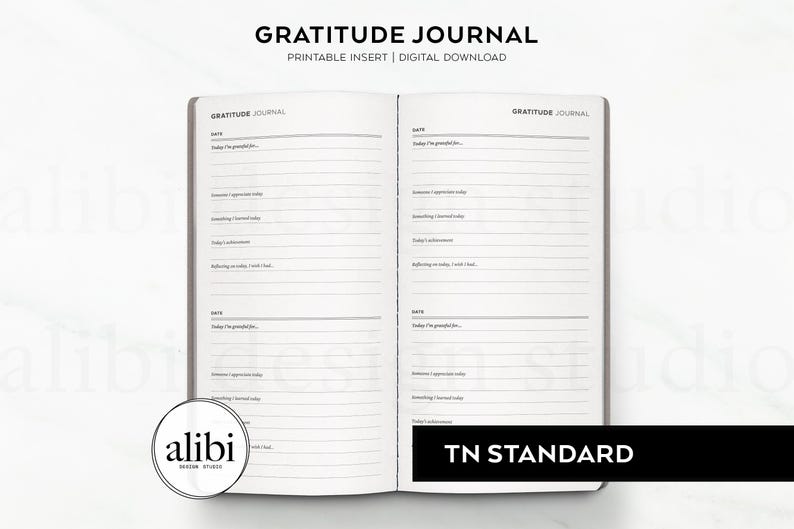 May include: A printable gratitude journal insert for a traveller's notebook. The insert has a simple design with lines for writing down things you are grateful for each day. The text "GRATITUDE JOURNAL" is printed at the top of the page.