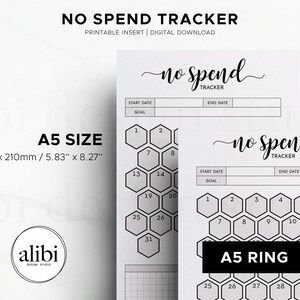 May include: A white "No Spend Tracker" printable insert with the text "no spend tracker" in a script font. The A5 size is 5.83" x 8.27". The design includes a honeycomb-shaped spending tracker with numbers.