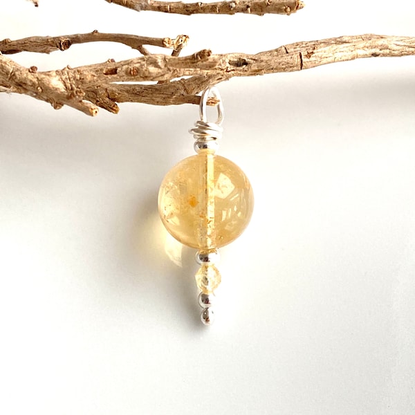 Pendant made of bright citrine and silver sterling