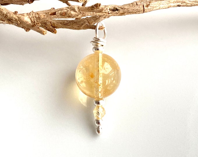 Pendant made of bright citrine and silver sterling